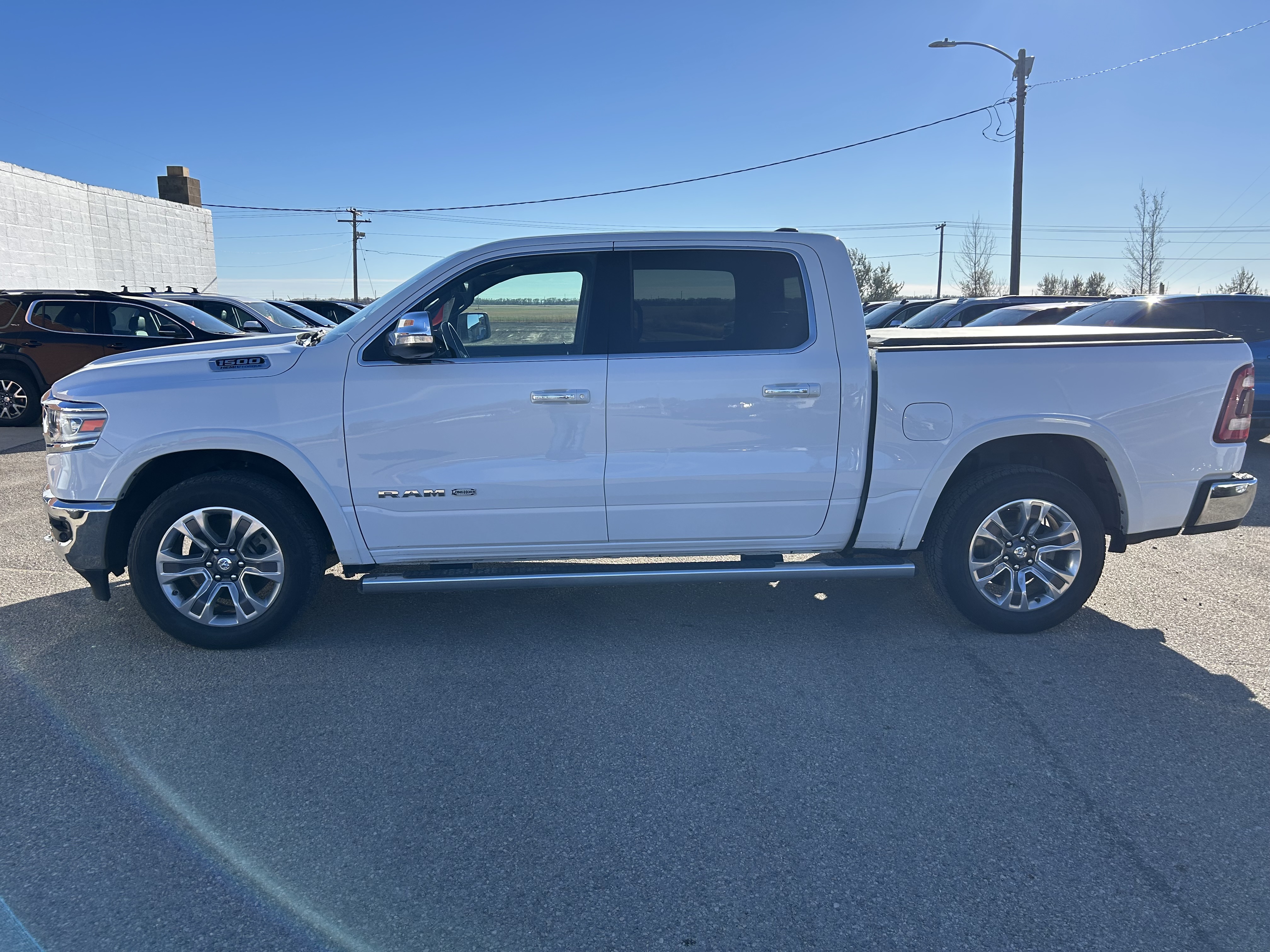 Used 2021 RAM Ram 1500 Pickup Longhorn with VIN 1C6SRFKT7MN815661 for sale in Bottineau, ND